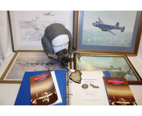 A post-War RAF flying helmet with oxygen mask, Shackleton Air Crew manual, Two books relating to RAF St. Mawgan, RAF cap badg