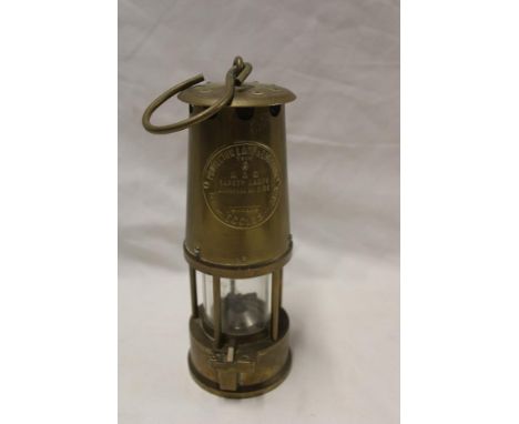 A brass miner's lamp by the Protector Lamp and Lighting Co.