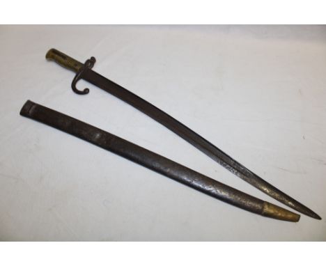 A French Chassepot bayonet with single edged blade and brass hilt in steel scabbard