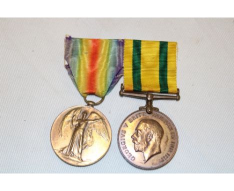 A First War victory medal and Territorial Force War medal awarded to No. 4402 Pte. E. Searle DCLI