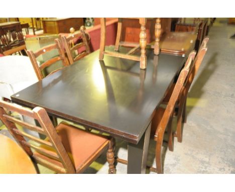 A Set of 6 ladder back dining chairs and a contemporary black extending dining table. (7)