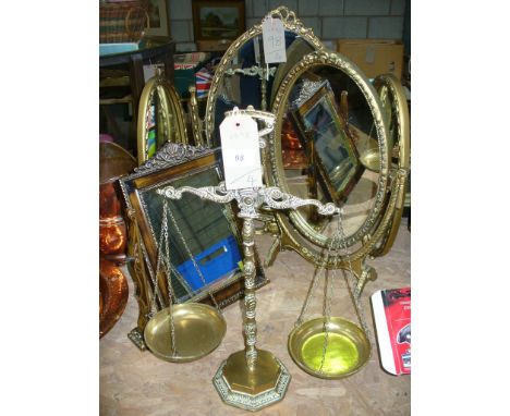 A Gilt framed triple oval dressing table mirror, a second oval dressing table mirror , one other and a set of brass balance s