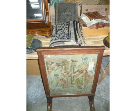 An Oak framed needlework firescreen, a Victorian family bible and throw. (3)
