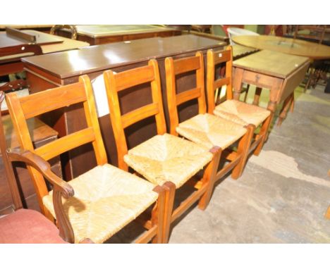 A Set of 4 rush seated ladder back kitchen chairs