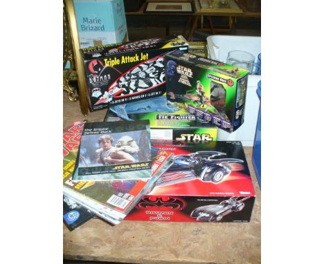 A Boxed Kenner " Star Wars" tie fighter, boxed Star Wars action figures, a Batman triple attack jet, boxed , a boxed Kenner b