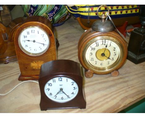 An Edwardian inlaid mahogany cased mantel clock , the white dial signed " Northern Goldsmith, Newcastle ", an early 20th cent