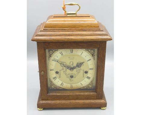 Franz Hermle retailed by Comitti London - C20th oak Georgian style bracket clock with caddy top and brass carrying handle on 