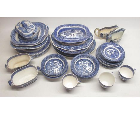 Collection of blue and white pottery inc. plates, lidded tureen, cream jugs, cups, saucers, etc. some being Old Willow, Staff