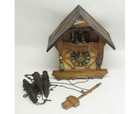 C20th painted and stained triple weight West German Black Forest striking and musical cuckoo clock, movement signed H29cm 