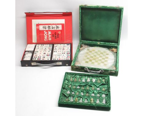 Cased green and milky-white chess set with circular board, and a cased Mahjong set (2) 
