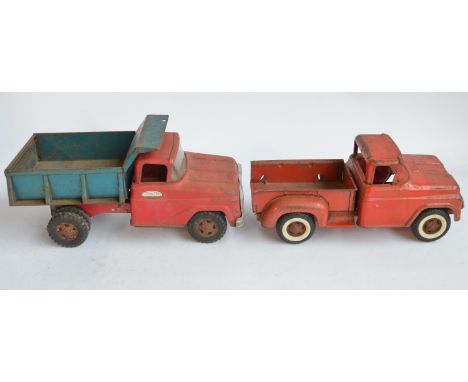 Two vintage pressed steel pick up truck models to include a Tonka Toys dump truck (in working order) and another by Buddy wit