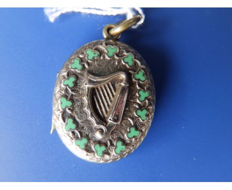 A Victorian gold oval locket enamelled with an Irish harp, with miniature thermometer to interior.