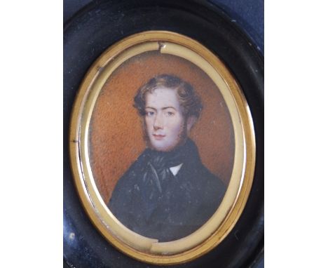19thC School – oval watercolour portrait miniature – Head & shoulders study of a young bearded man in black – typed label to 