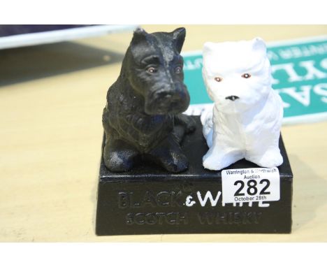 Cast iron Black and White Scotch whisky dogs, H: 14 cm. P&amp;P Group 1 (£14+VAT for the first lot and £1+VAT for subsequent 