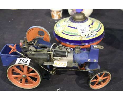 Vintage metal spinning top and a Mamod type steam engine in need of repair. Not available for in-house P&amp;P 