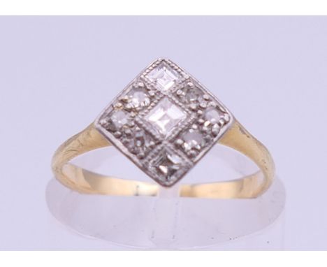An Art Deco unmarked gold diamond set ring. Ring size I. 2.1 grammes total weight.