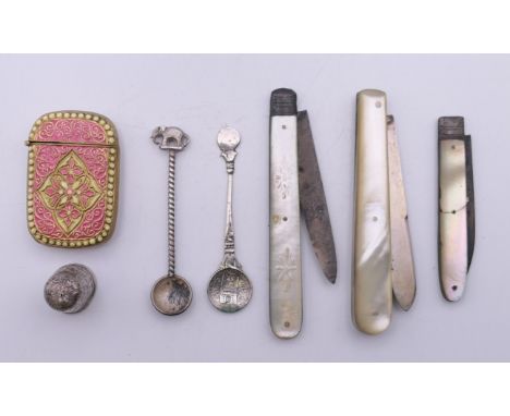 Three silver bladed mother-of-pearl fruit knives, an enamelled decorated brass vesta, etc.  Largest fruit knife 8.5 cm long, 