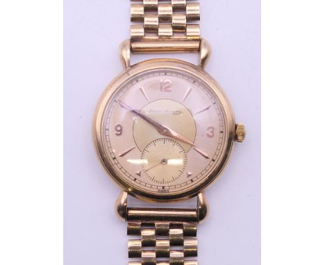 A 9 ct gold Jaeger LeCoultre gentleman's wristwatch. 3.5 cm wide. 52.5 grammes total weight.