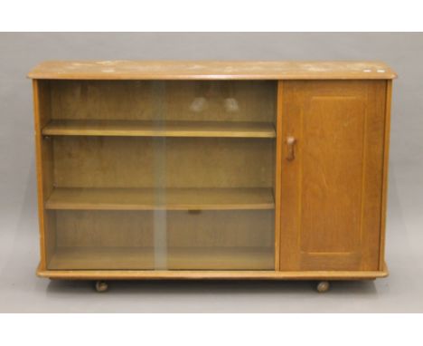 An Ercol side cabinet. 135 cm wide.