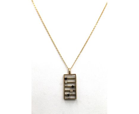 A 9 ct gold diamond and sapphire abacus form pendant on chain. 2.5 cm high. 2.8 grammes total weight.