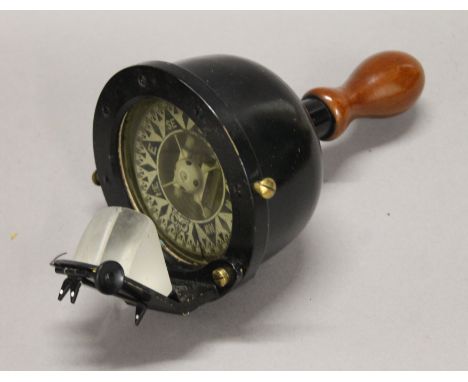 A Hezzanith hand held marine compass, in fitted wooden box. The box 28.5 cm wide.