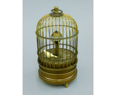 A birdcage clock. 15 cm high.