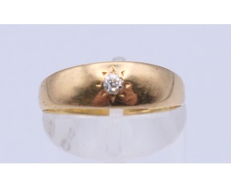 An 18 ct gold gypsy set diamond ring. Ring size O. 2 grammes total weight. 