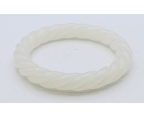 A white jade twist bangle.  5.75 cm internal diameter.