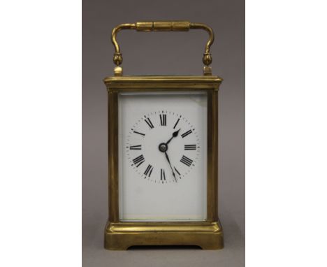 A brass cased carriage clock. 15.5 cm high.