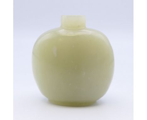 A small Chinese light green jade snuff bottle (stopper missing), Qing Dynasty. 4.5 cm high.Provenance: The Larkin/Minney Coll