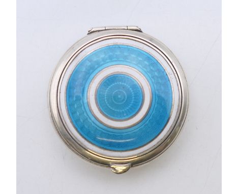 An silver and enamel decorated pill box, hallmarked for Birmingham 1910, maker's mark of Levi & Salaman.  4 cm diameter.