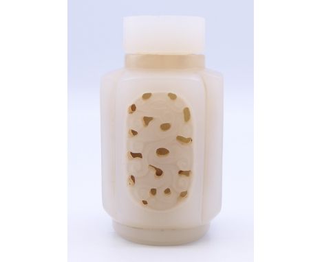 A Chinese light pink and white reticulated jade snuff bottle (stopper missing), Qing Dynasty. 6.5 cm high.Provenance: The Lar