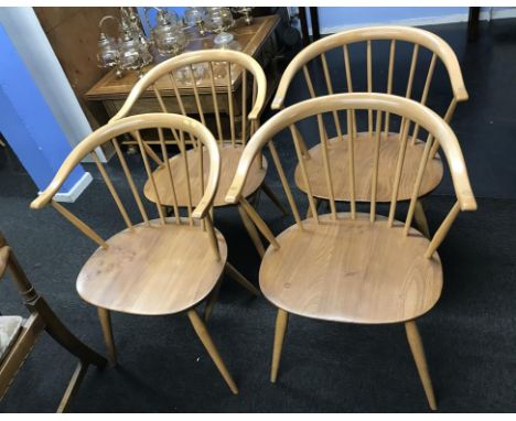 A set of four pale elm Ercol 'Cow Horn' dining chairs, model 449A