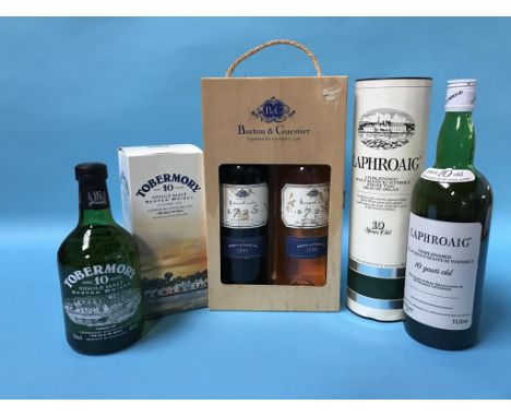 A bottle of Tobermory 10 year old whisky, a bottle of Laphroaig 10 year old Scotch whisky etc.