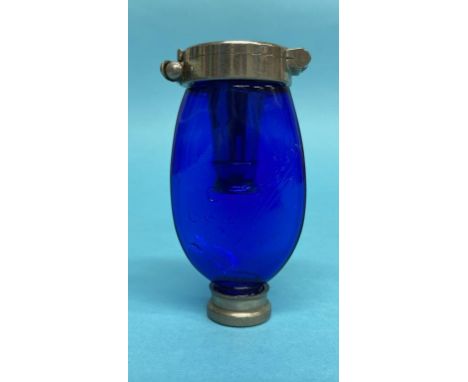 A blue glass Dr. Dettweilers pocket Blue Henry cobalt glass and metal sputum flask for the prevention of consumption.  Dr. De