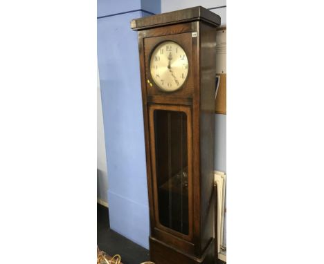 A 1930s oak longcase clock