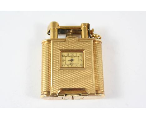 AN 18CT. GOLD DUNHILL LIGHTER CLOCK the signed rectangular-shaped dial with Arabic numerals, with engine turned decoration, 5