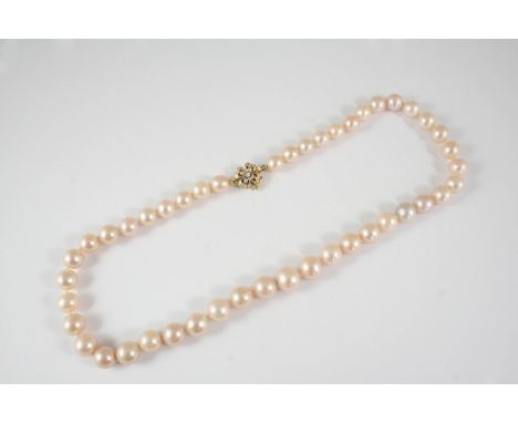 A SINGLE ROW CULTURED PEARL NECKLACE the slightly graduated pearls measure approximately 8.2mm. to 10.7mm., and are set to a 