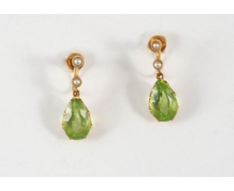 A PAIR OF PERIDOT AND CULTURED PEARL DROP EARRINGS each earring set with a pear-shaped peridot drop suspended from two small 