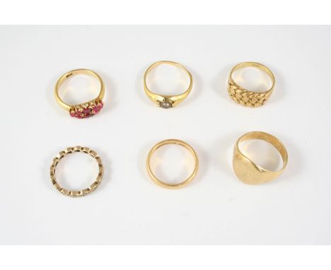 AN 18CT. GOLD SIGNET RING 6.0 grams, size P, together with an 18ct. gold wedding band, 4.1 grams, size L 1/2, a ruby and 18ct