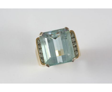 AN AQUAMARINE AND DIAMOND RING the step-cut aquamarine is set with five circular-cut diamonds to each shoulder, in 18ct. gold