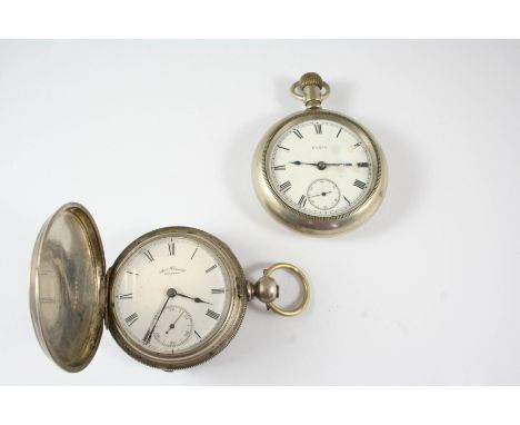 A METAL OPEN FACED POCKET WATCH BY ELGIN the signed white enamel dial with Roman numerals and subsidiary seconds dial, 50mm. 