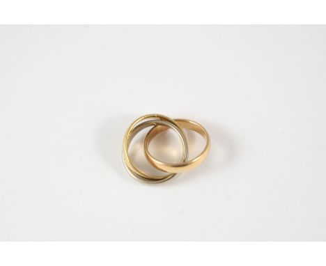 AN 18CT. THREE COLOUR GOLD TRIPLE BAND RING 12.7 grams. Size K.