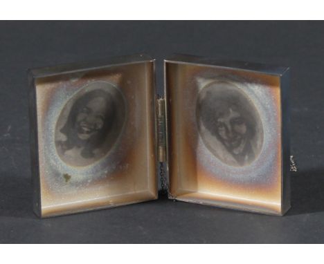 •LAURA POTTER  SILVER BOX. A white coloured metal box of rectangular form with domed centres, hinged, opening to reveal two p