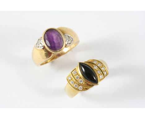 AN AMETHYST AND DIAMOND RING the oval-shaped amethyst is set with small diamonds, in gold, size K 1/2, together with a black 