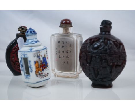 Four Chinese Snuff Bottles including an Inside Painted Glass Bottle, Carved Horn Effect Bottle, Cinnabar Style Bottle and a C