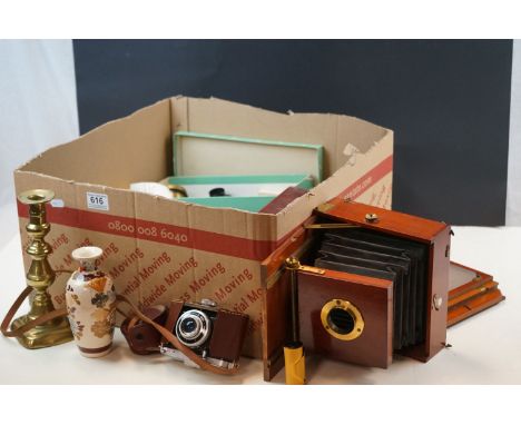 A quantity of sundries tom include brass ejector candles sticks, harvest stoneware tankard, vintage camera etc. 