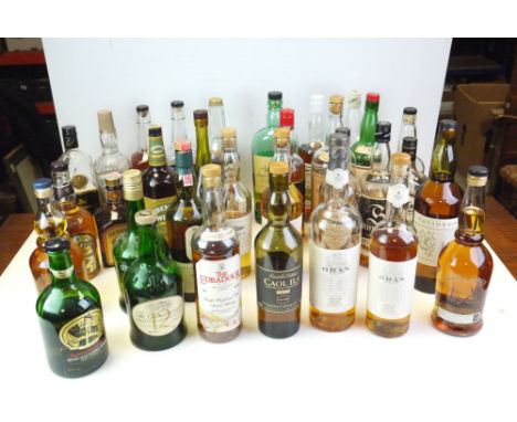 A large quantity of bottled spirits Whisky to include Bourbon opened partially  consumed, Chivas Scotch Whisky. quantity of s