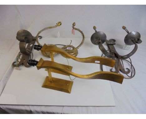 A wrought iron Gothic style twin branch wall light one other similar single, a pair Of Porto Romano wall lights in the form o