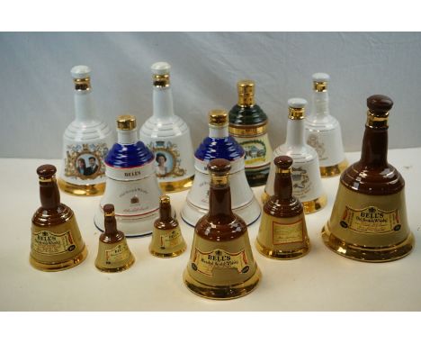 Thirteen Wade Whisky Coronation and other decanters eleven with contents. 